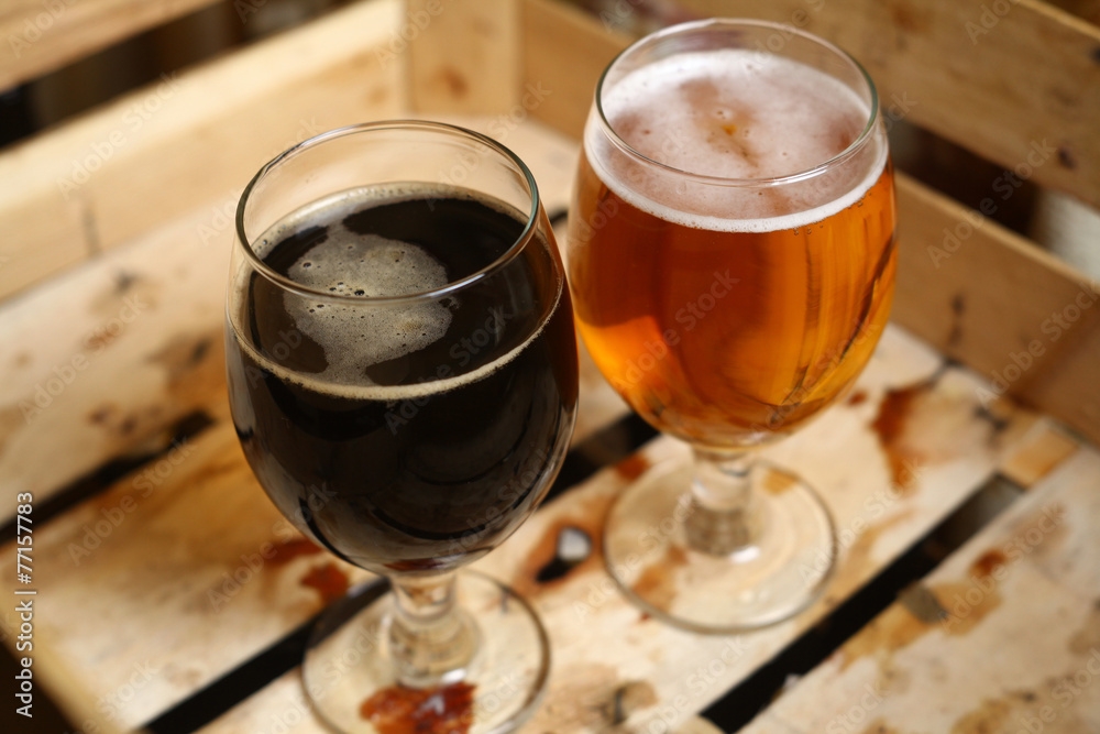 Two glasses of beer in a crate Two glasses of beer in a crate