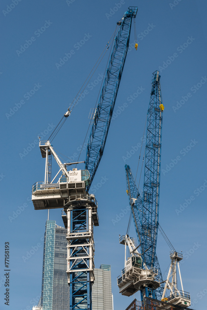 Cranes on construction work of high rise buildings