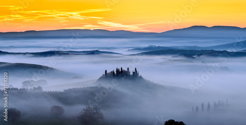 Sunrise and mist in Tuscany Field