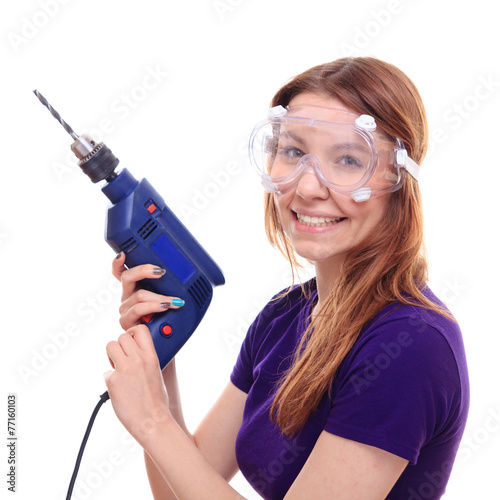 Young woman with a drill