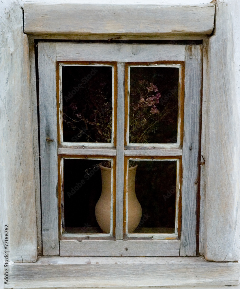 Obraz premium Detail of a window of a typical ukrainian antique house