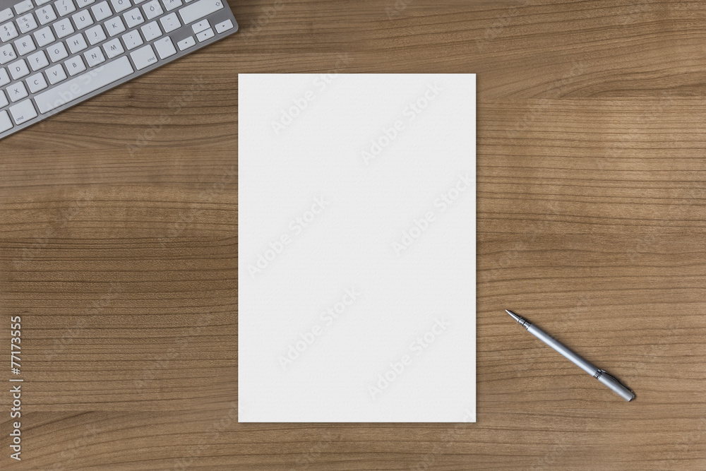 Blank sheet on a wooden table Blank sheet on a wooden table
