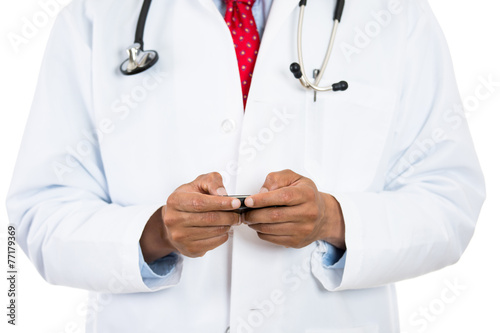 Closeup doctor hands texting reading message on mobile phone photo