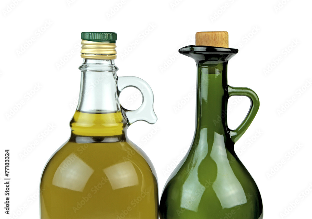 Extra virgin olive oil in glass bottles on white background. Extra virgin olive oil in glass bottles on white background.