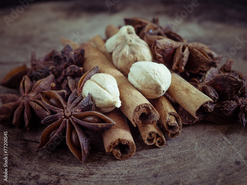 cinnamon sticks and star anise on wood background