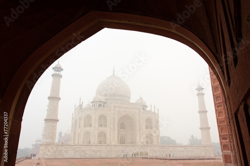 Framing of Taj Mahal mausoleum in a foggy morning