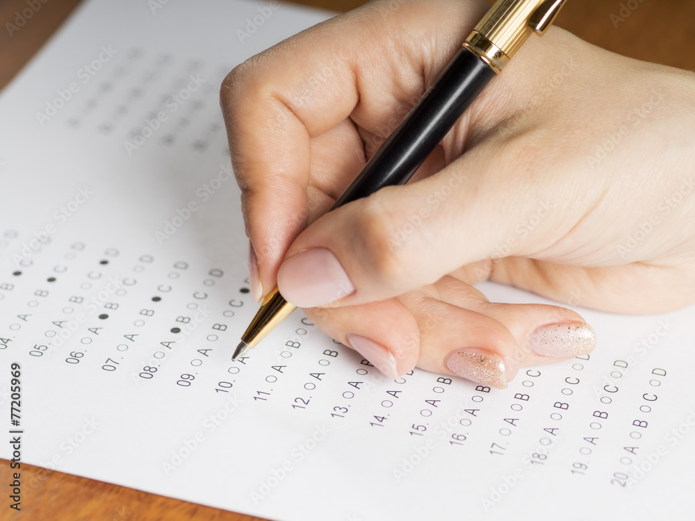 Girl fills out a questionnaire Girl fills out a questionnaire