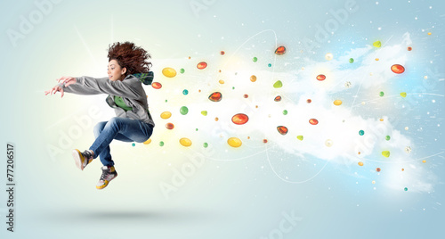 Beautiful woman jumping with colorful gems and crystals on the b © ra2 studio