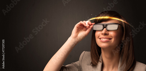 Pretty woman looking with futuristic high tech glasses © ra2 studio