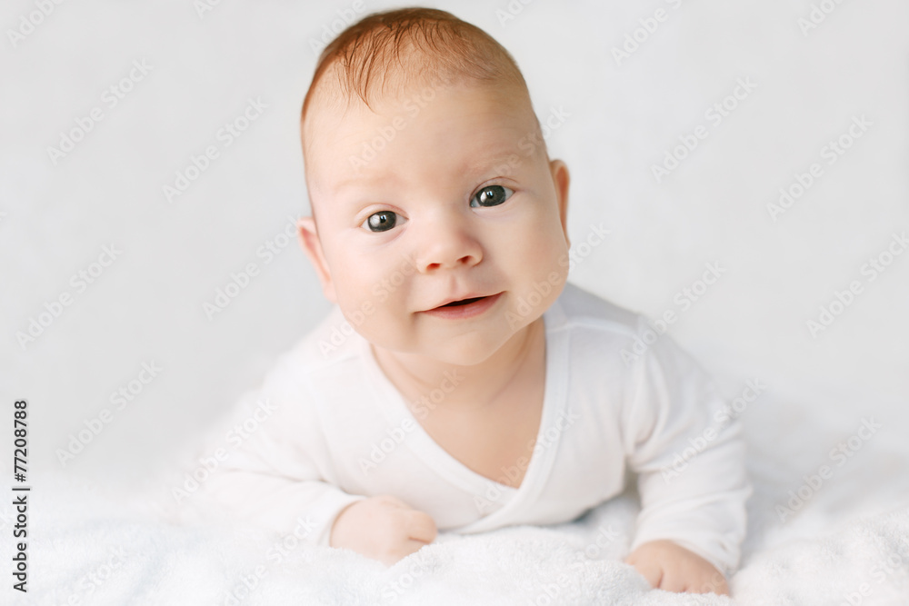 Beautiful cute laughing baby. Boy or girl on white. Little child