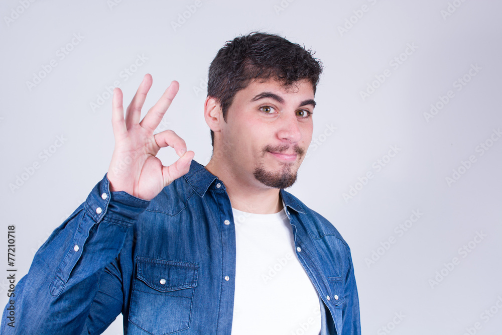 Man making the gesture OK Man making the gesture OK
