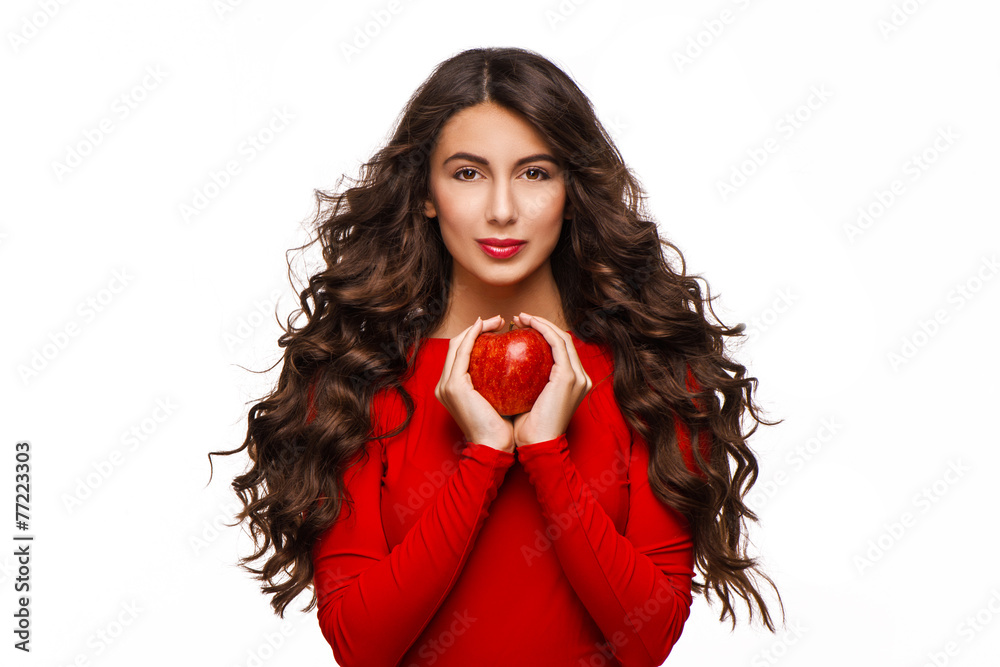 Beautiful young woman holding red apple