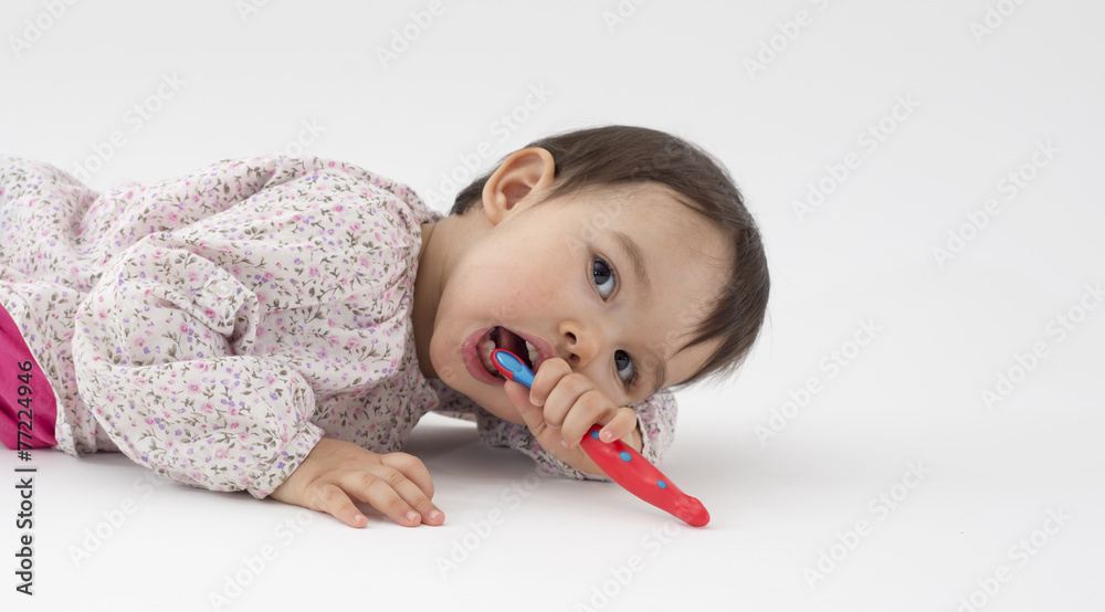 Little girl with toothbrush in her hand on white background Little girl with toothbrush in her hand on white background