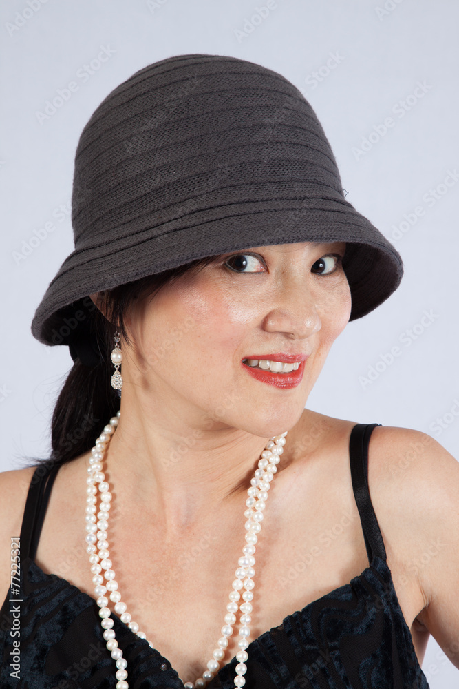 Asian woman looking at the camera with a smile Asian woman looking at the camera with a smile