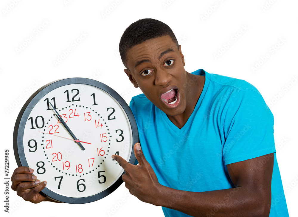 man holding wall clock, stressed pressured by lack of time man holding wall clock, stressed pressured by lack of time