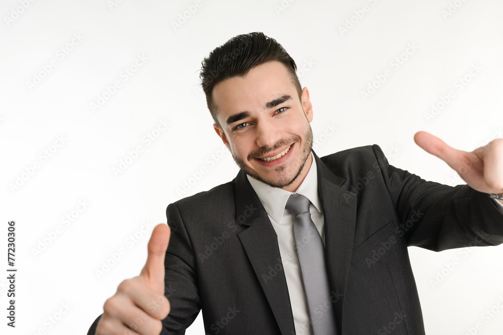 isolated business man in positive attitude with his thumbs up isolated business man in positive attitude with his thumbs up