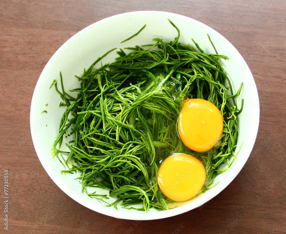 egg yolk on vegetable in the bowl egg yolk on vegetable in the bowl