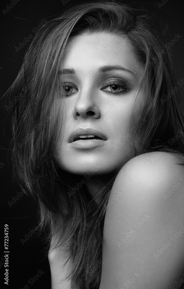 Naklejka premium Young woman on black