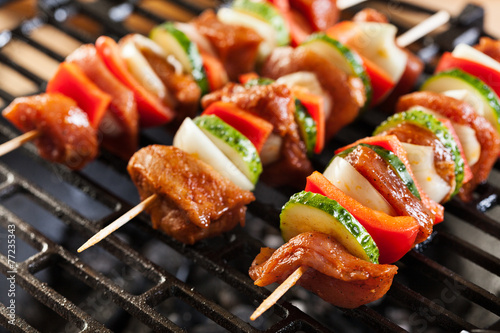 Grilling shashlik on barbecue grill