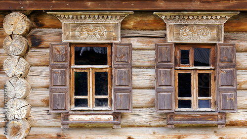 facade of the old log house in the museum of wooden architecture #77235779