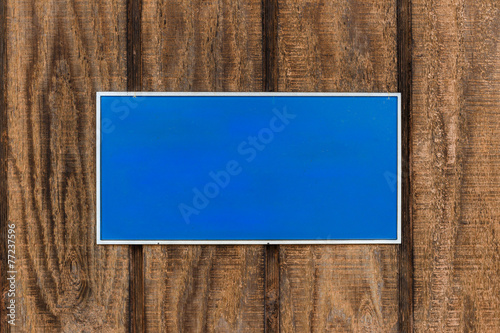 Slika na platnu Blue Sign on Wooden Wall
