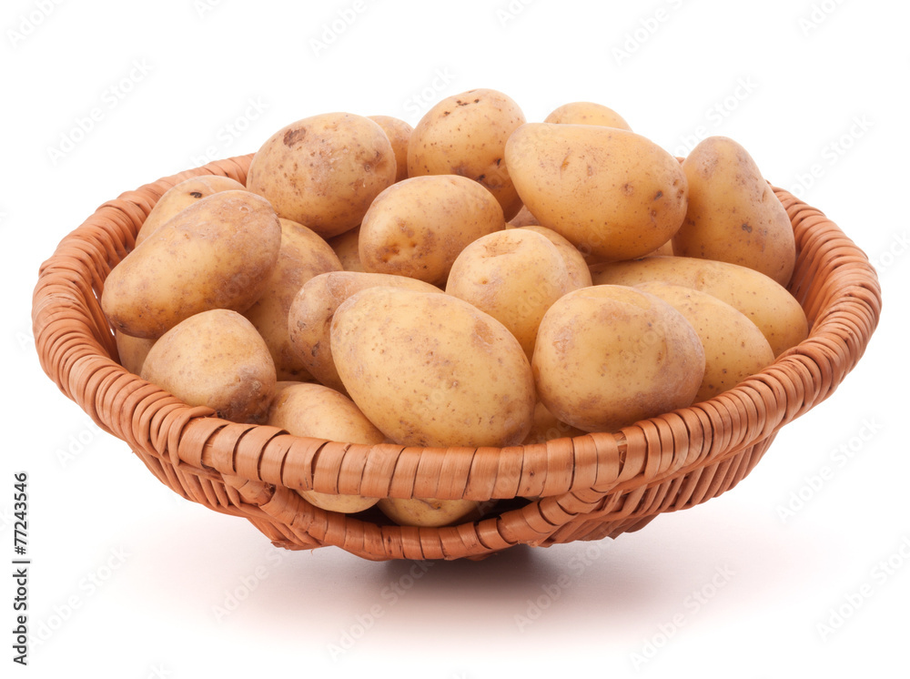 Potato tuber in wicker basket isolated on white background Potato tuber in wicker basket isolated on white background