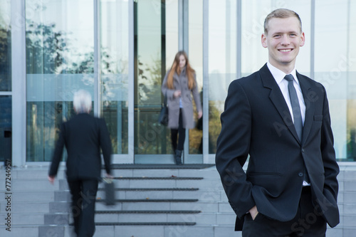 Businessman standing in front of office