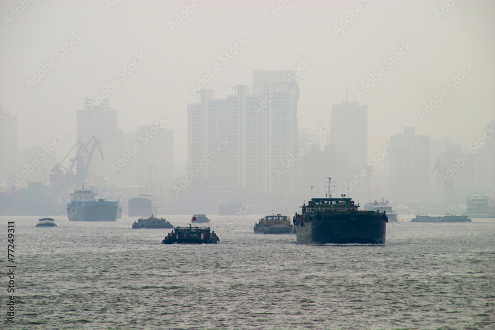 Shanghai Skyline with boats in thick Fog