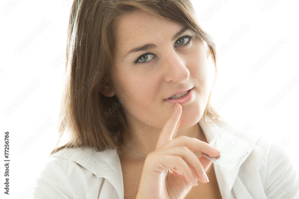 sexy brunette woman holding condom and looking at camera sexy brunette woman holding condom and looking at camera