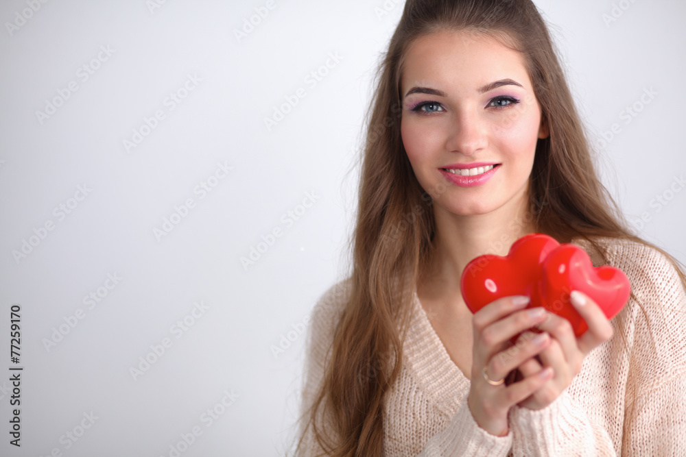 Portrait of beautiful happy woman holding a symbol heart. Portrait of beautiful happy woman holding a symbol heart.