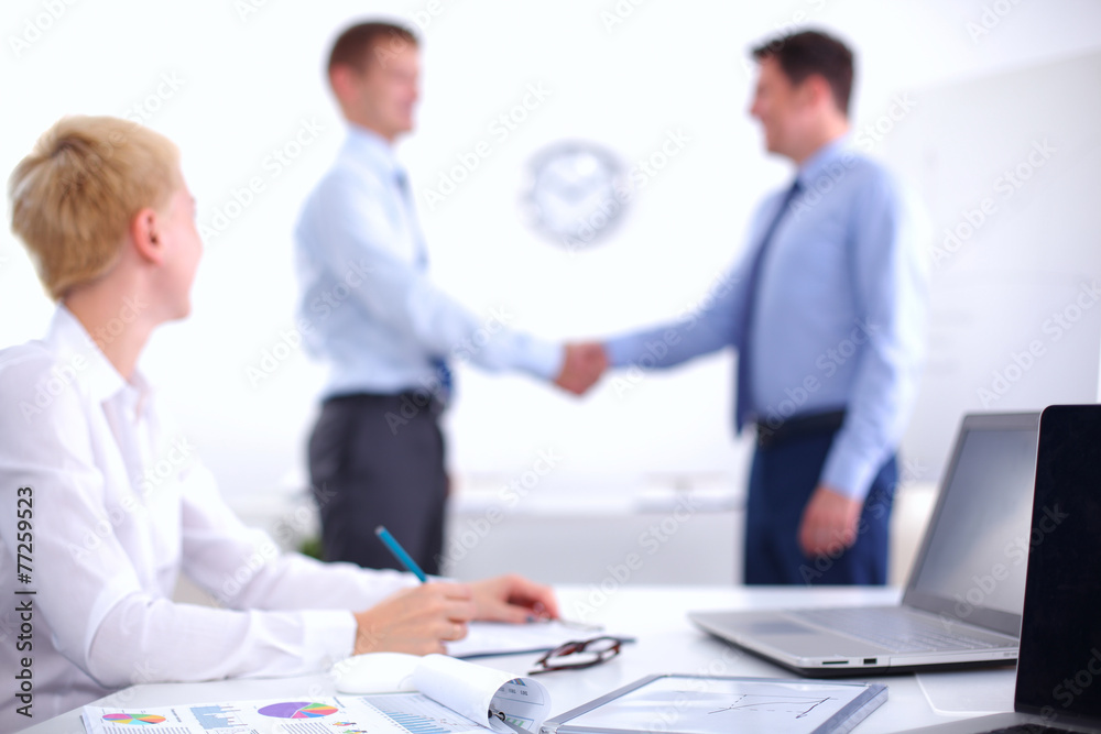 Business people shaking hands, finishing up a meeting Business people shaking hands, finishing up a meeting