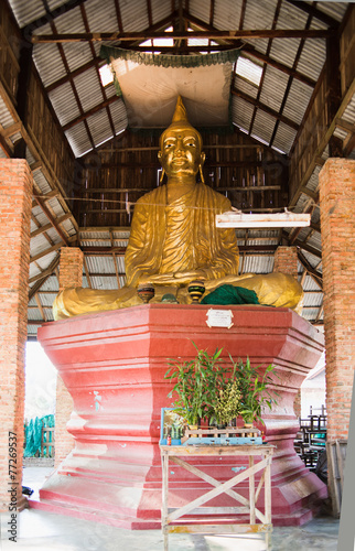 Buddha image in simple pavilion photo