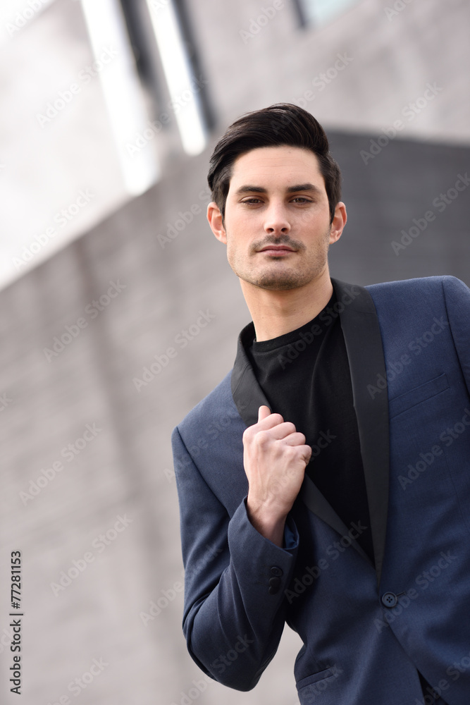 Attractive young businessman in urban background Attractive young businessman in urban background