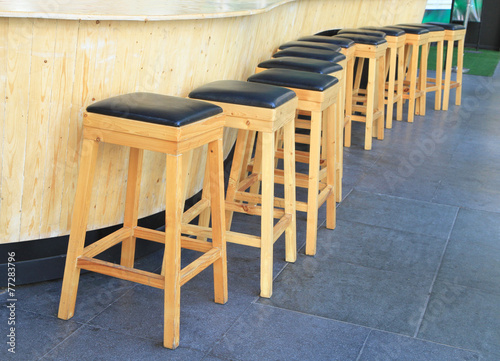 Lined up of wooden bar stools