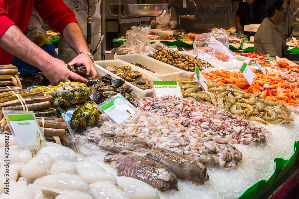 Fototapeta premium Fresh seafoods at the market La Boqueria in Barcelona. Spain