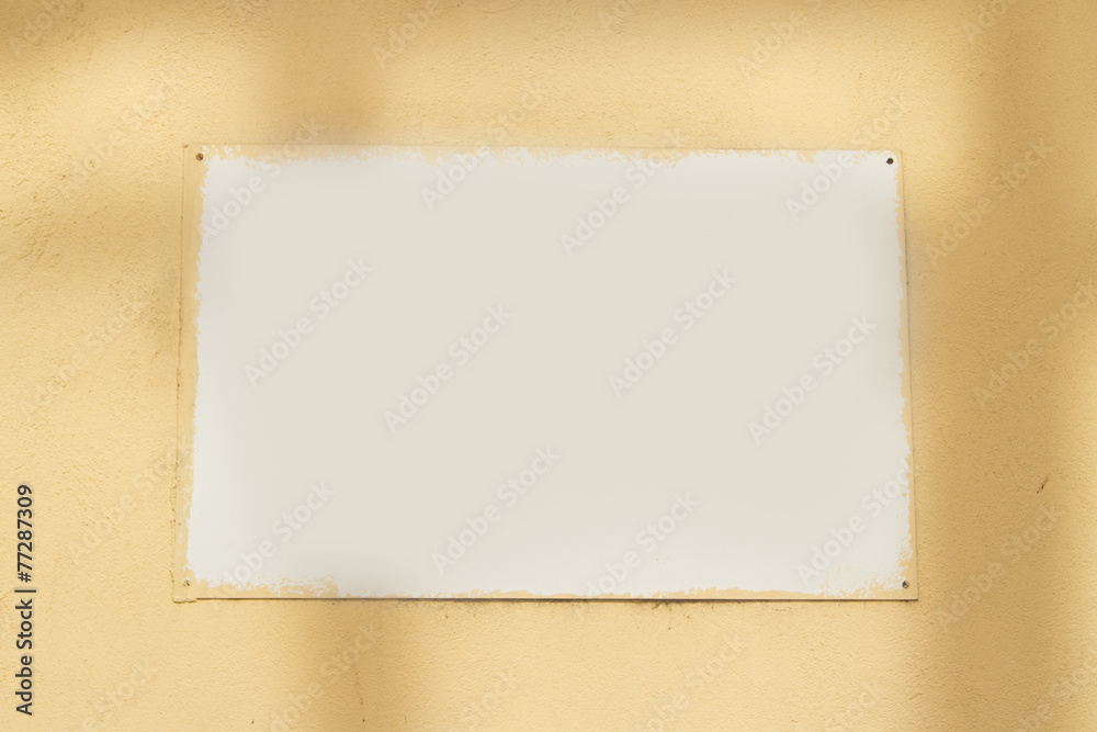 White Sign Board on Wall