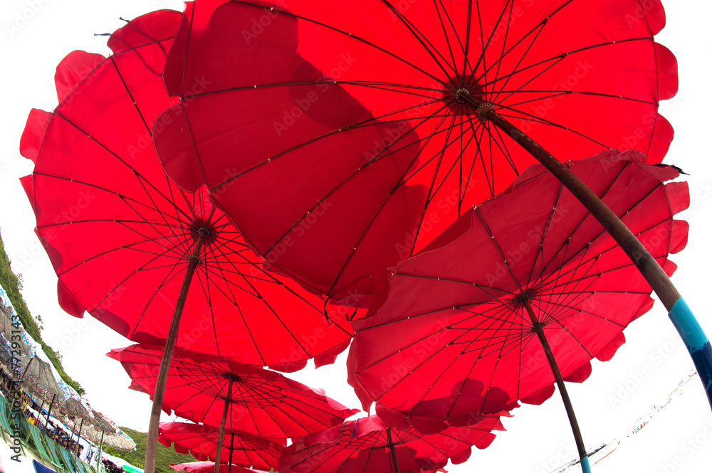 Red umbrella on the beach.
