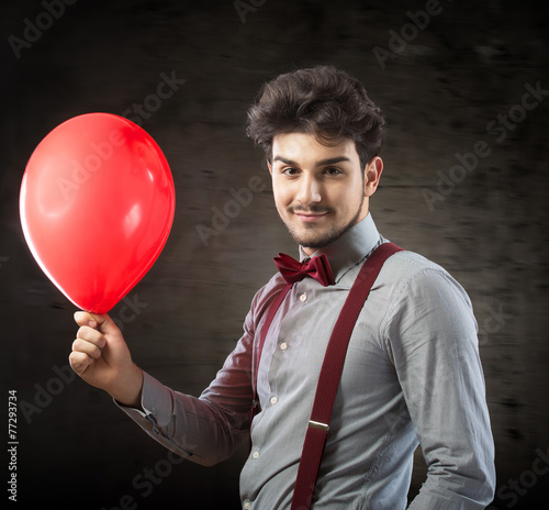 Smiling man with a red balloon © rodjulian