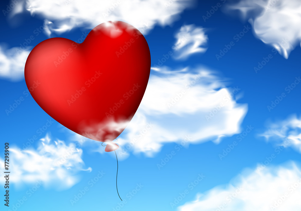 Red heart balloon in sky.