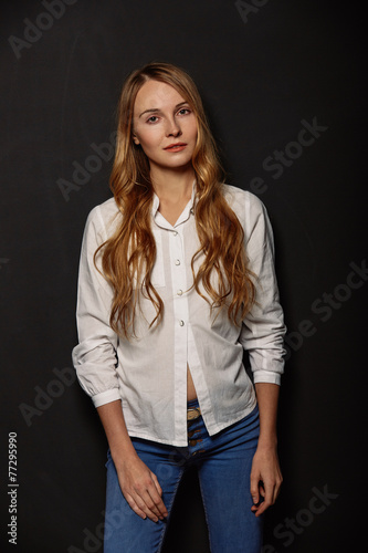 Attractive girl portrait in a white shirt