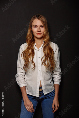Attractive girl portrait in a white shirt
