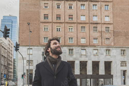 Wallpaper Mural Young handsome bearded man posing in the city streets Torontodigital.ca