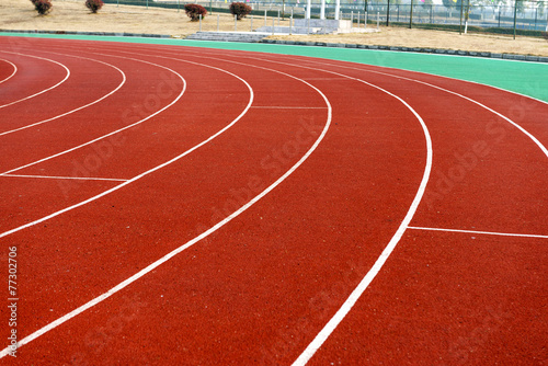 red plastic runway and numbers in a sports ground