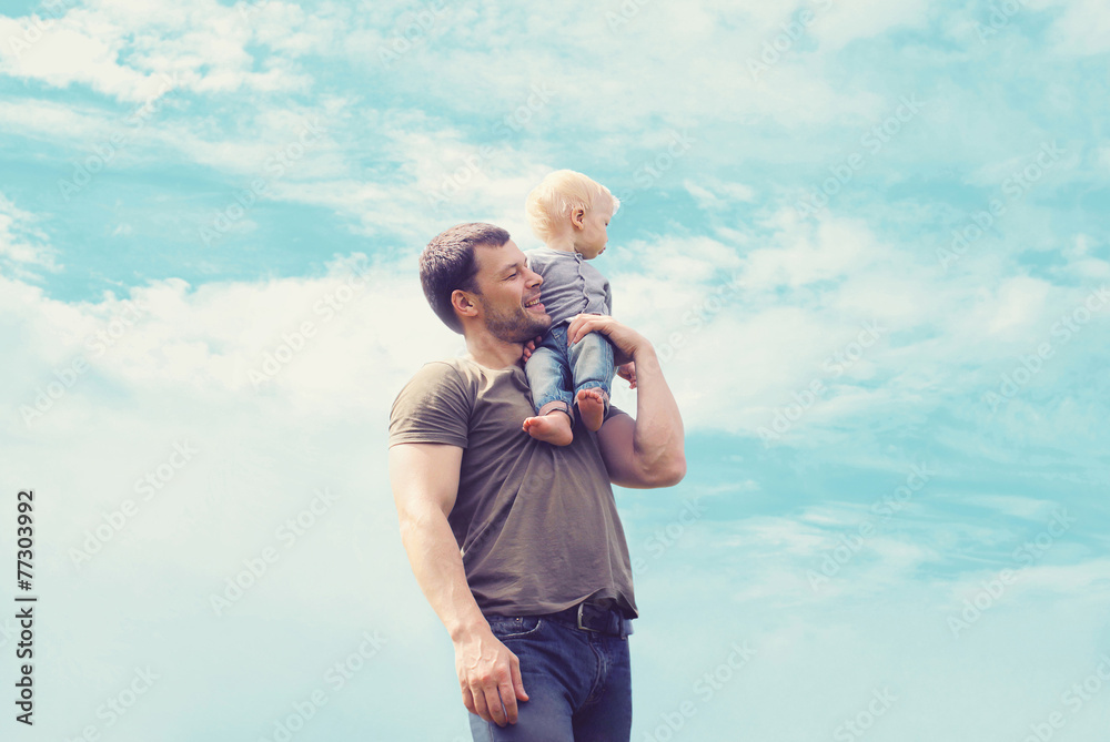 Lifestyle atmospheric portrait happy father and son having fun