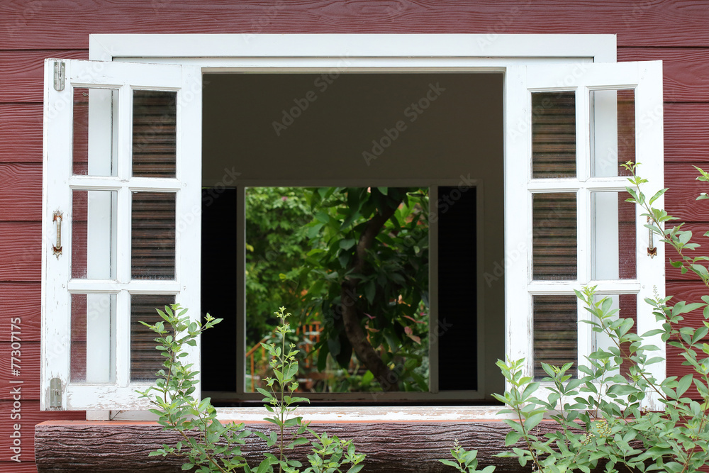white wood window on wooden house white wood window on wooden house