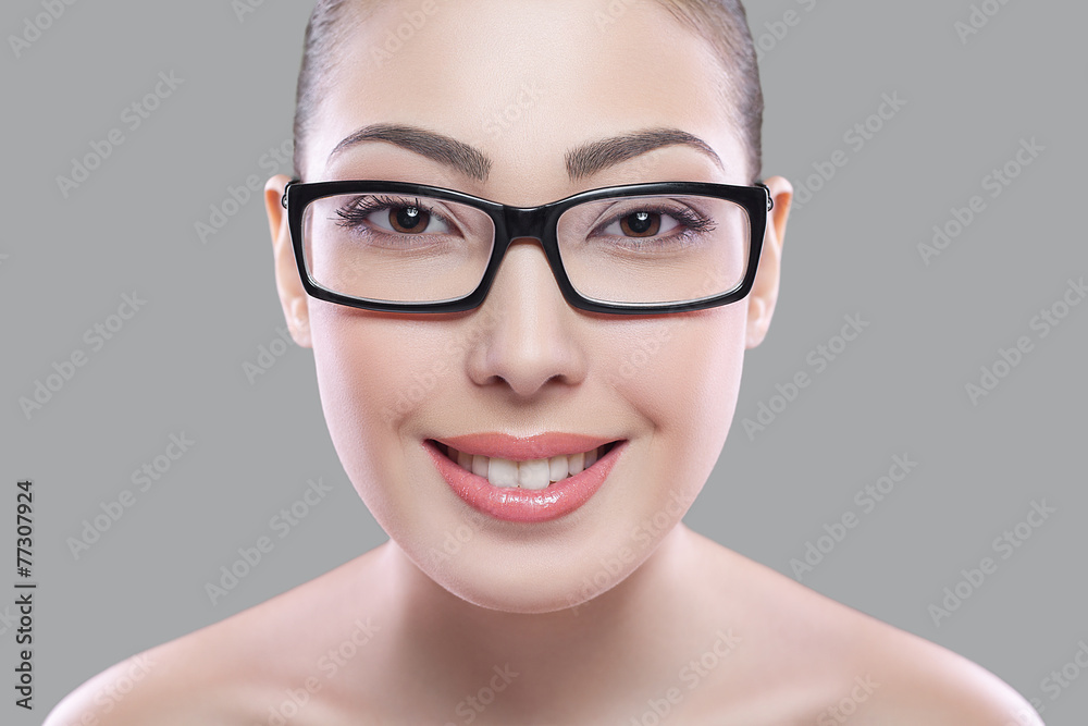 Portrait of a beautiful female model on grey background Portrait of a beautiful female model on grey background