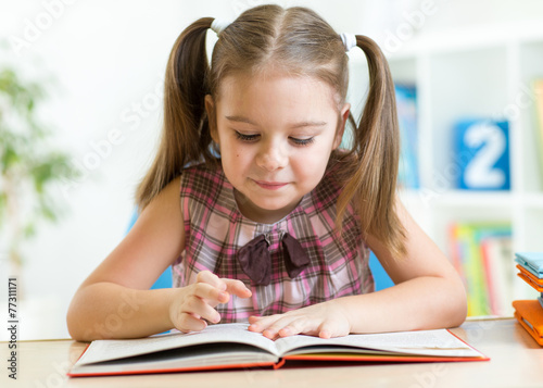 Cute kid girl reading story...