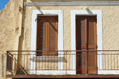 Balcony in an old building in the town of Chania photo
