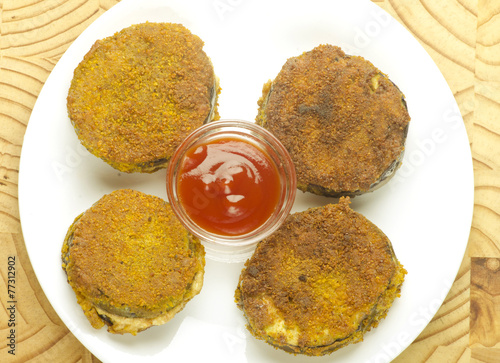 Eggplant fry with bason Traditional indian snacks photo