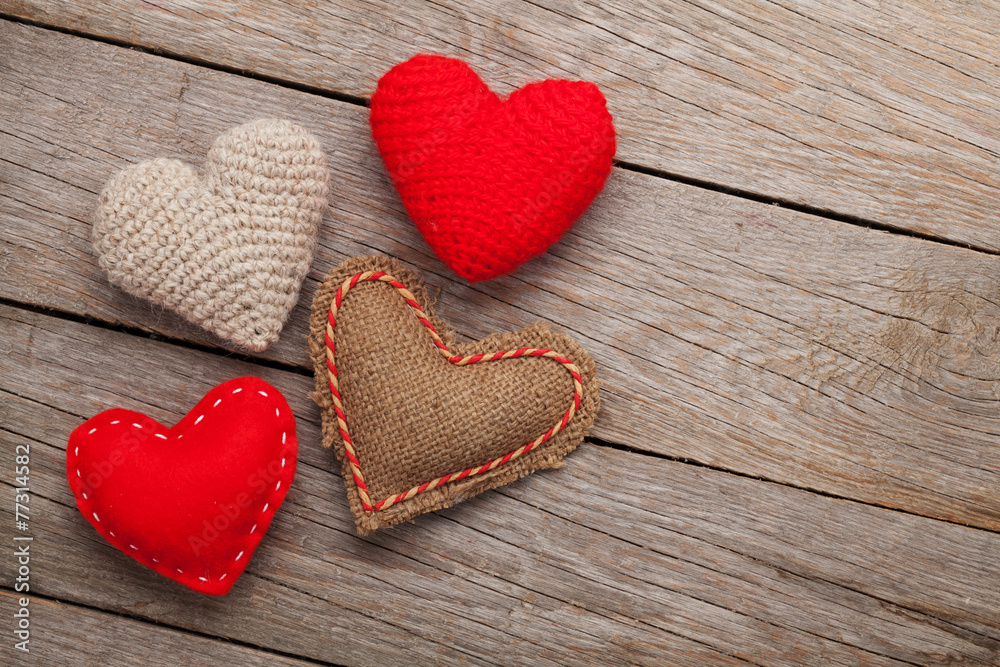 Valentines day background with handmade toy hearts